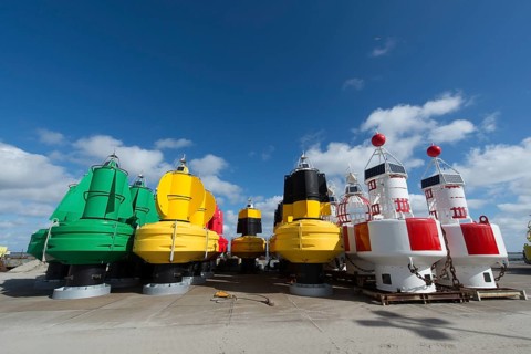 Colorful buoys in stock at the Dutch wadden island Terschelling