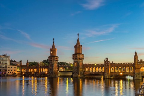 Berlin Germany, sunset city skyline at Oberbaum Bridge and Spree River