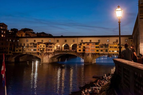 Famous Ponte Vecchio in Florence illuminated at night, Italy, Europe