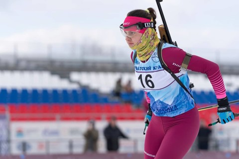 Kamchatka sportswoman biathlete Anastasia Ivchenko skiing on distance biathlon complex. Open