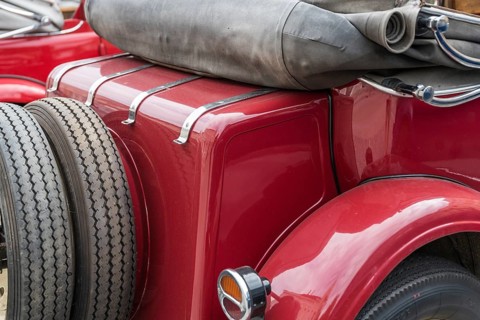 Convertible from behind with spare tyre - close-up of saloon