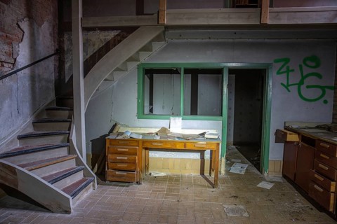 Old abandoned paper factory. Historic and typical factory building as a lost place. Destruction and