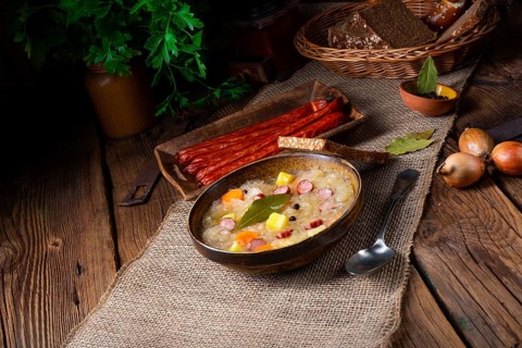 Rustic sauerkraut soup with bacon and sausage