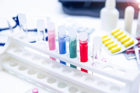 Colorful test tubes and medicine on a bright laboratory table