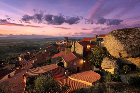 Monsanto historic village with stone boulder buildings and landscape at sunset, in Portugal