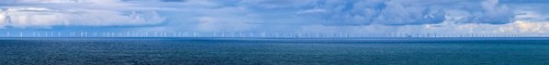 Panoramic photo offshore wind farm in the middle of the deep blue North Sea, photographed from