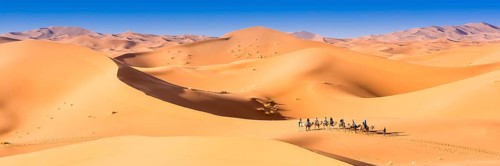 Merzouga in the Sahara Desert in Morocco. Afica. Web banner in panoramic view
