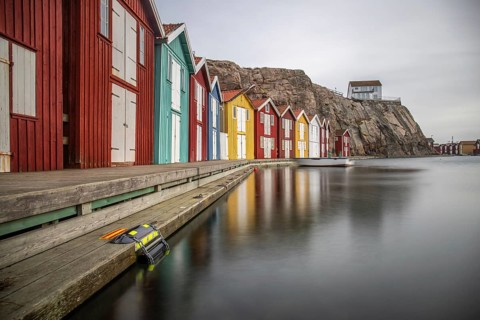 Small colourful houses by the sea. Typical houses in Sweden for the coastal landscape. Crab fishing