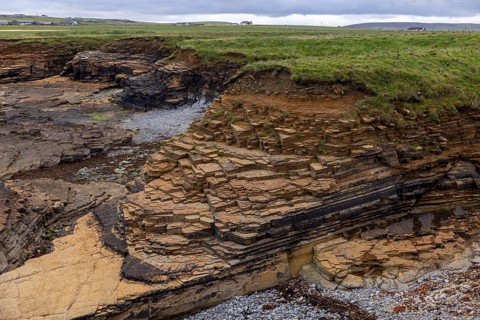 Tilted Devonian sandstone layers, sheltered bay of Skiba Geo, Northside, Mainland Orkney, Scotland,