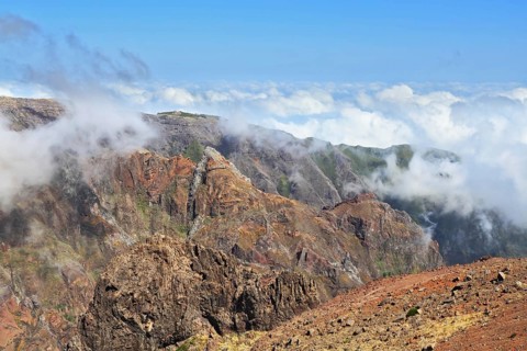 The highest peak of Madeira Island - Pico Ruyvu. By strong wind in the mountains of Madeira flying
