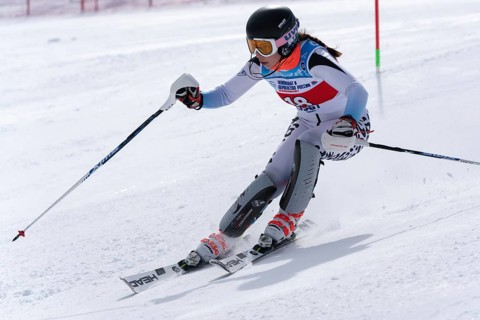 Mount skier Naumova Alexandra Murmansk Region skiing down mount slope. International Ski Federation