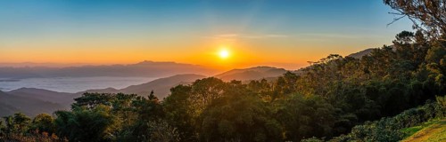 Tropical forest nature landscape with mountain range sunrise with moving cloud mist, Chiang Mai