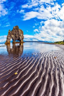 Rock Hvitserkur in the form of a huge mammoth on the sea beach. The north coast of Iceland. The