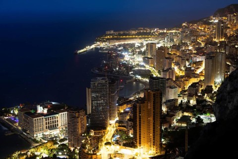 Monte Carlo panorama illuminated by night. Urban landscape with luxury architecture