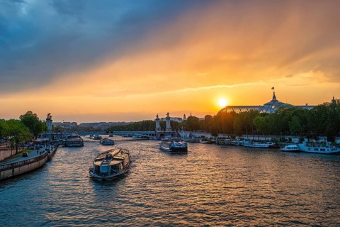 Paris France, city skyline sunset at Seine River with Pont Alexandre III bridge and Grand Palais