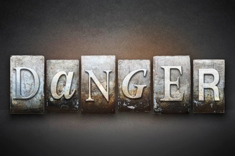 The word DANGER written in vintage letterpress type