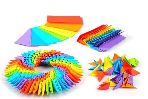 Colorfull origami 3d units like a rainbow circle isolated on white with shadow. From sheets of