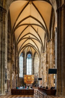 Vienna, Austria, 22 September, 2022: people praying during a church service in one of the side