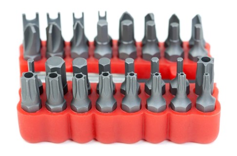 Set of heads for screwdriver in red box isolated on white background