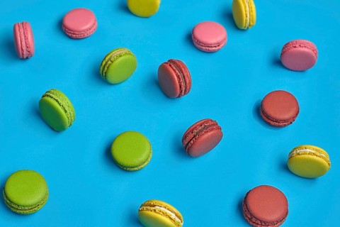 Top view of a nice macarons or macaroons, sweet meringue-based confection with a ganache,