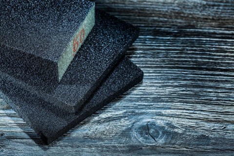 Polishing abrasive blocks on vintage wooden board