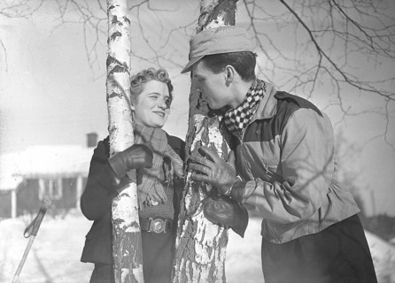 Winter in the 1940s. A young couple is enjoying their winter vacation, and they are wearing the