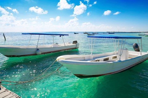 Puerto Morelos beach boats in Mayan Riviera Maya of Mexico