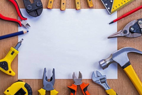 Organized copyspace horizontal version white blank sheet of paper and tools on wooden board