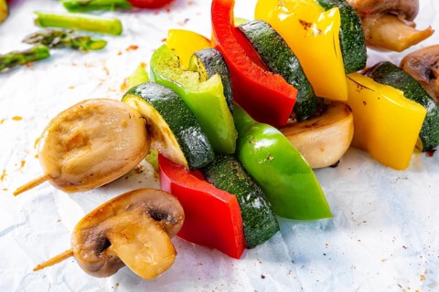 Vegetarian skewers white mushrooms, peppers and zucchini for barbecue