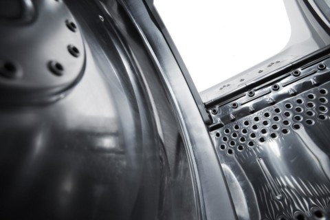 Interior view of a new european top loading washing machine. Very short depth-of-field