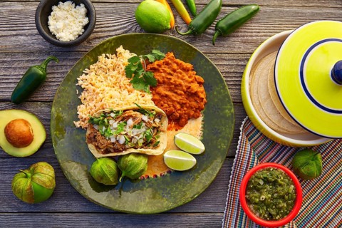 Mexican carnitas tacos with salsa and Mexico food ingredients