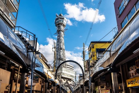 OSAKA, JAPAN - SEPTEMBER 26 2024: The famous Shinsekai area with Tsutenkaku Tower on a clear autumn