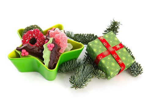 Green star full with christmas chocolate and present