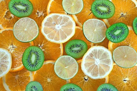 Kiwi, lime, lemon, orange slices background