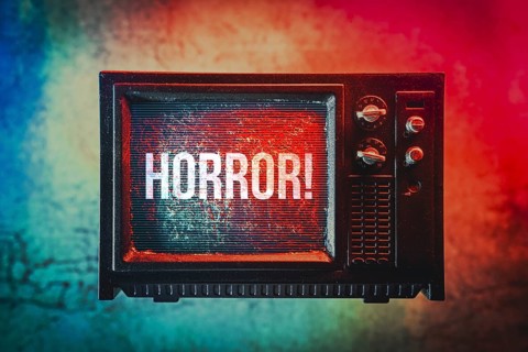 Miniature television set labelled Horror, photomontage