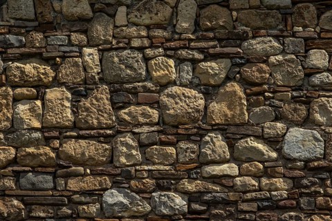 Old medieval stone and brick wall background