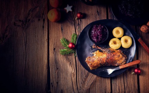 Roast goose with baked apples, red cabbage and dumplings
