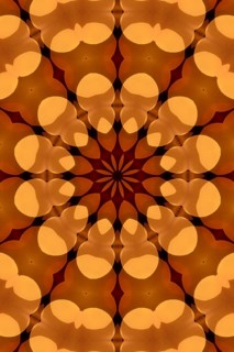 Abstract kaleidoscope pattern in warm colours Abstract kaleidoscope pattern in warm colours