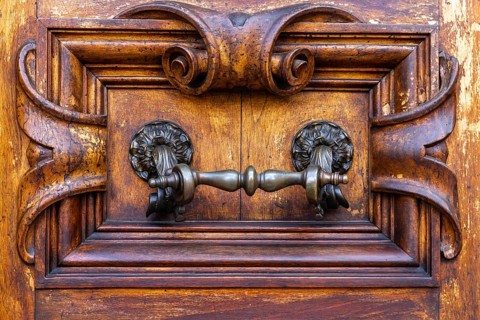 Close up of rustic old door in Florence, Italy, Europe