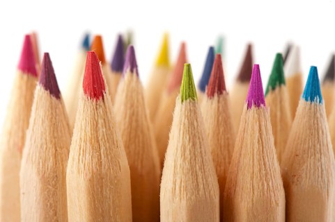Many wooden color pencils isolated over white
