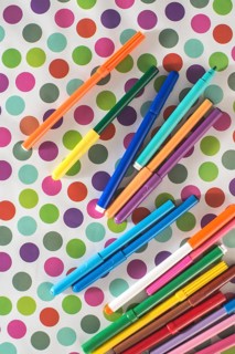 Pens on colorful circles background