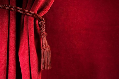 Red theatre curtain and red tassels