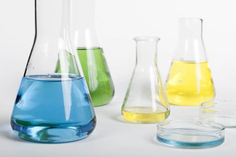 Laboratory glassware equipment. Laboratory beakers filled with colored liquid substances
