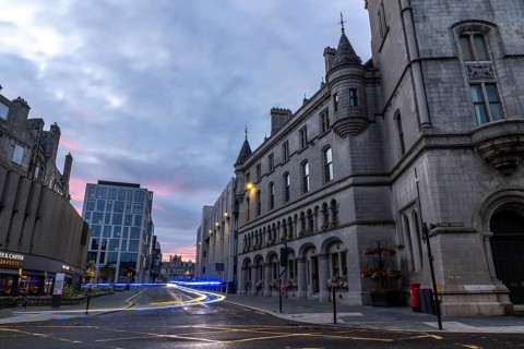Emergency vehicle with flashing lights leaves traces of light, evening mood, Broadstreet with Town