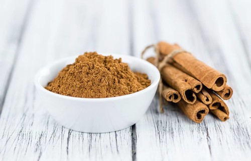 Portion of fresh made Cinnamon (close-up shot, selective focus)