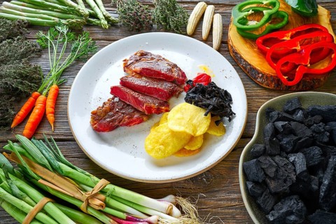 Charcoal grilled beef tenderloin with french fries and piquillo peppers and caramelized shallots