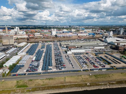 Car terminal in a port on the Rhine. Vehicles are stored, loaded and unloaded, and prepared for