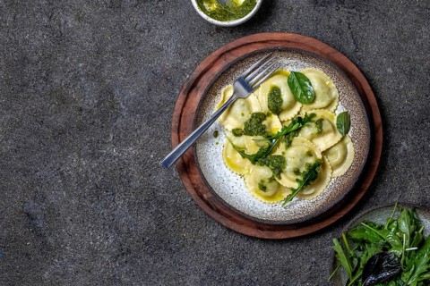 Food, Italian spinach ricotta ravioli, Top view, black background, copy space, Vegetarian food,