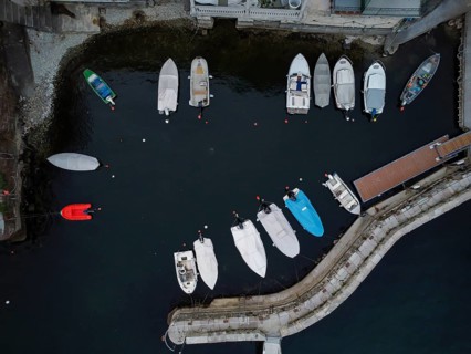 Aerial view of a dock with moored boats