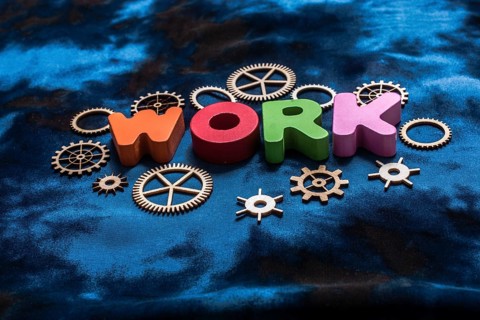 Work wording and wooden cogwheels as industry mechanism concept